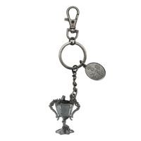 Silver trophy-shaped keychain with a tag on a white background