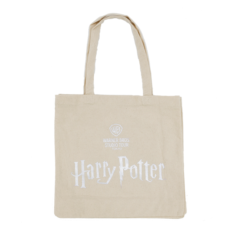 Beige tote bag with 'Harry Potter' and Warner Bros. Studio logo on a white background