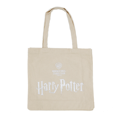 Beige tote bag with 'Harry Potter' and Warner Bros. Studio logo on a white background