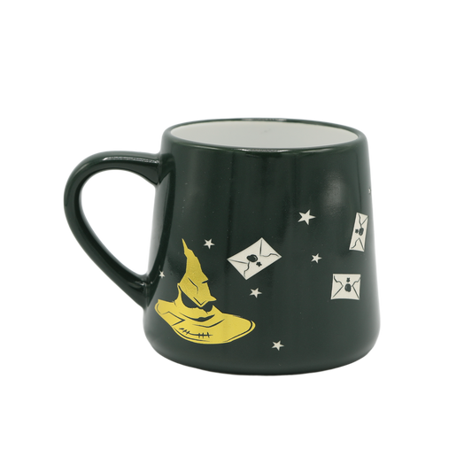 Dark green mug with yellow sorting hat and white acceptance letters on a transparent background