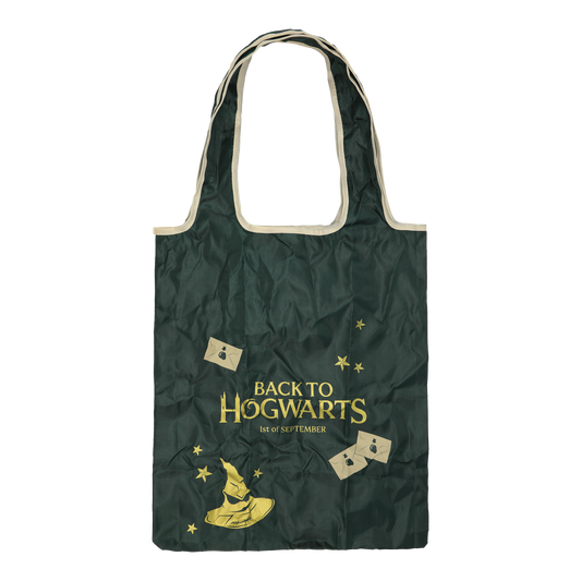 Green tote bag with 'Back to Hogwarts' text and wizard-themed graphics