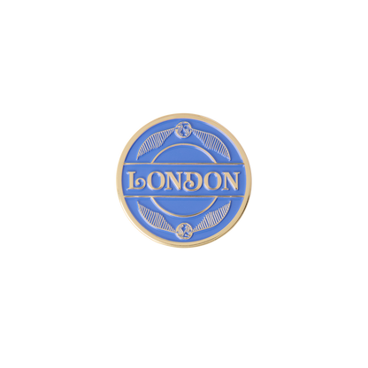 Round blue and gold Quidditch magnet with 'London' text 