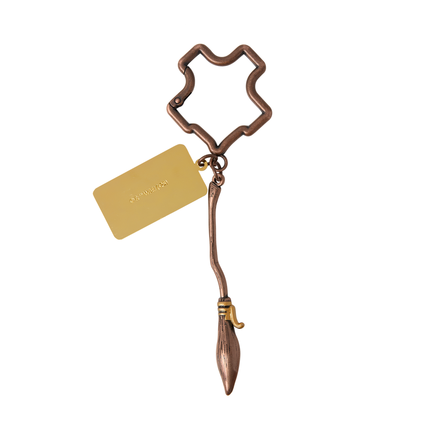 Bronze Nimbus 2000 keychain with a Hogwarts crest-shaped holder and gold tag on a white background