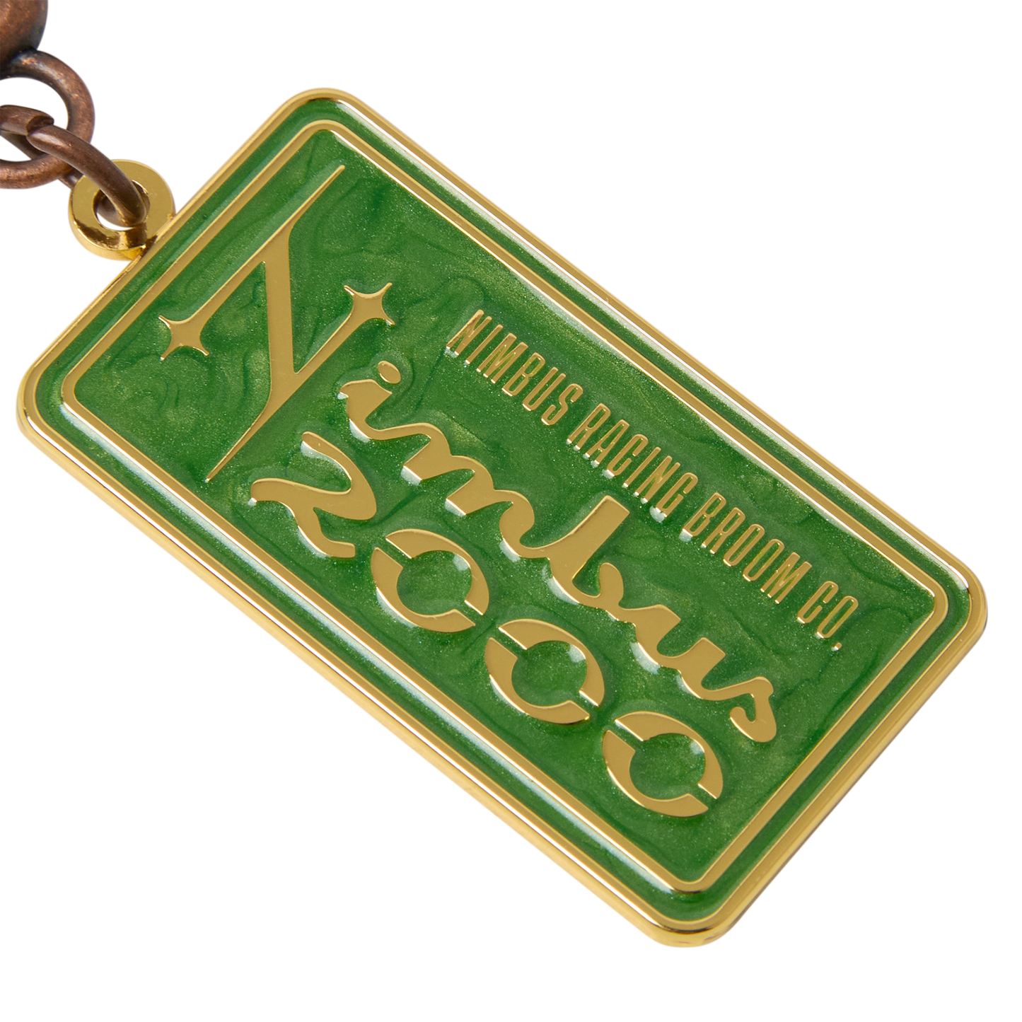 Green and gold rectangular tag with 'Nimbus Racing Broom Co.' text on a white background