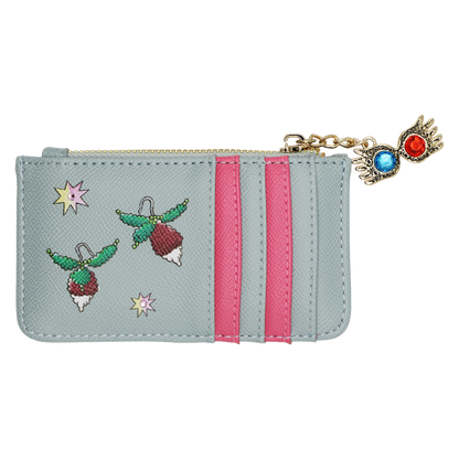 A light blue faux leather zippered pouch featuring embroidered radish earrings, pink  stripes, and a gold-tone Spectrespecs charm with blue and red crystals in the lenses.