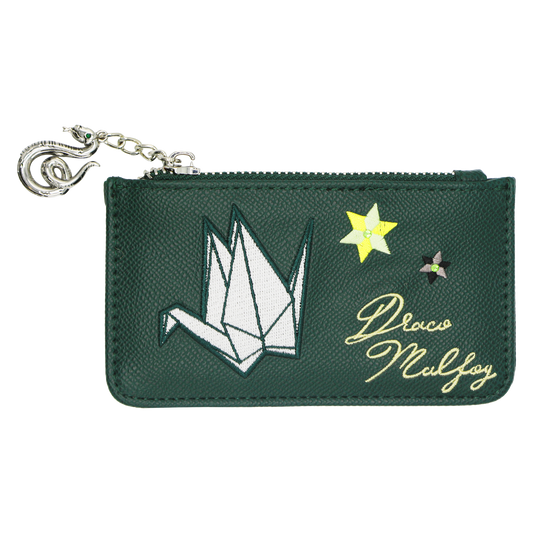 A dark green textured leather card holder  featuring an embroidered white origami crane, a yellow star, a small gray star, and the cursive text 'Draco Malfoy' in gold. It has a silver-tone metal zipper with a matching snake charm.