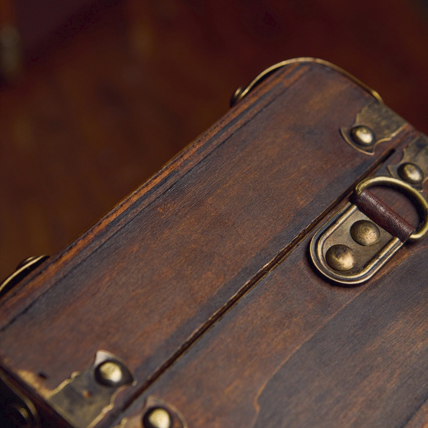 GIF featuring the side of a Harry Potter Gift Trunk with gold foiled text on displaying the initials HJG